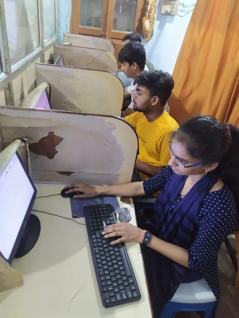Students practicing typing and basic computer operations at SRCC lab