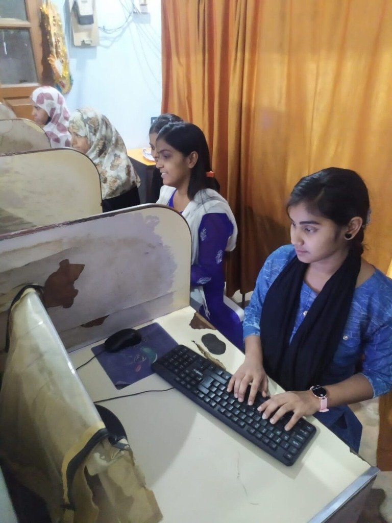 Students practicing typing in the lab booths at SRCC