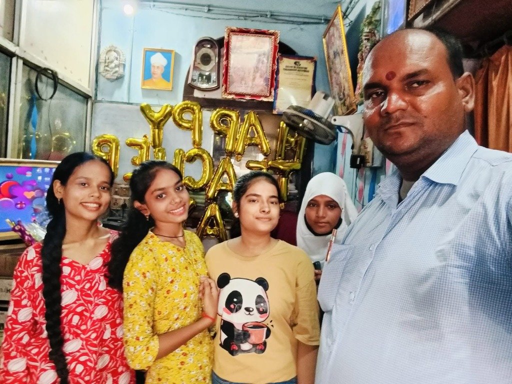 Group selfie of students with director at SRCC